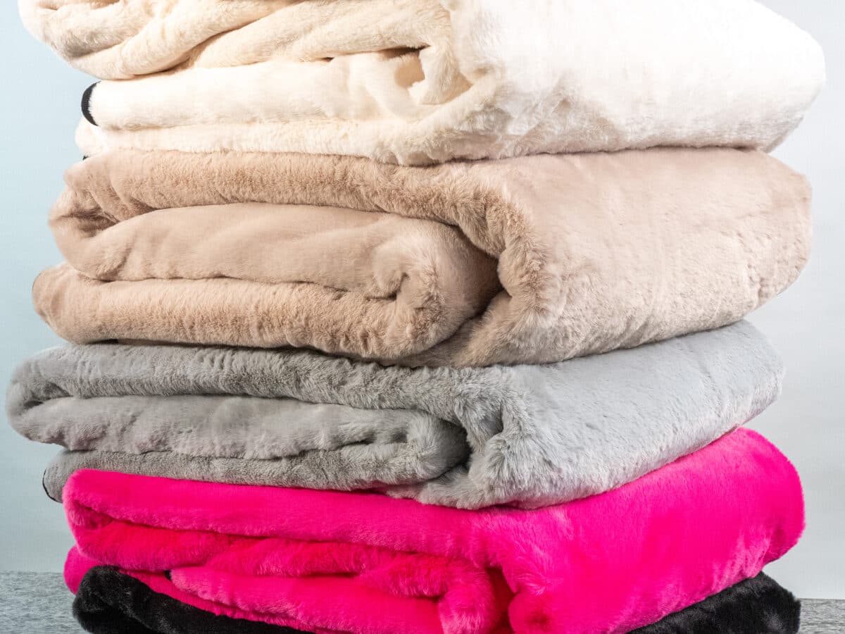 The Swanky Blanky, plush faux fur on the back with a custom NubaySoft 2.0 school design printed on the front